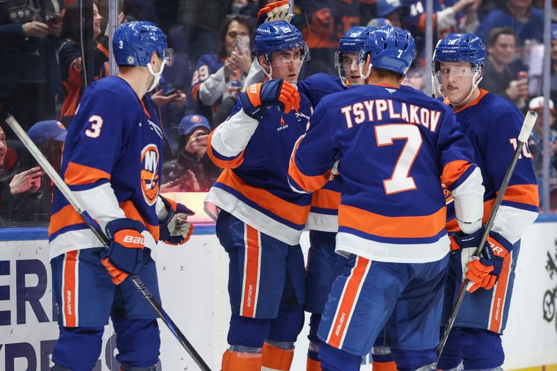 Mar 4, 2025; Elmont, New York, USA;  New York Islanders center Brock Nelson (29) celebrates with his teammates after scoring a goal in the second period against the Winnipeg Jets at UBS Arena. Mandatory Credit: Wendell Cruz-Imagn Images