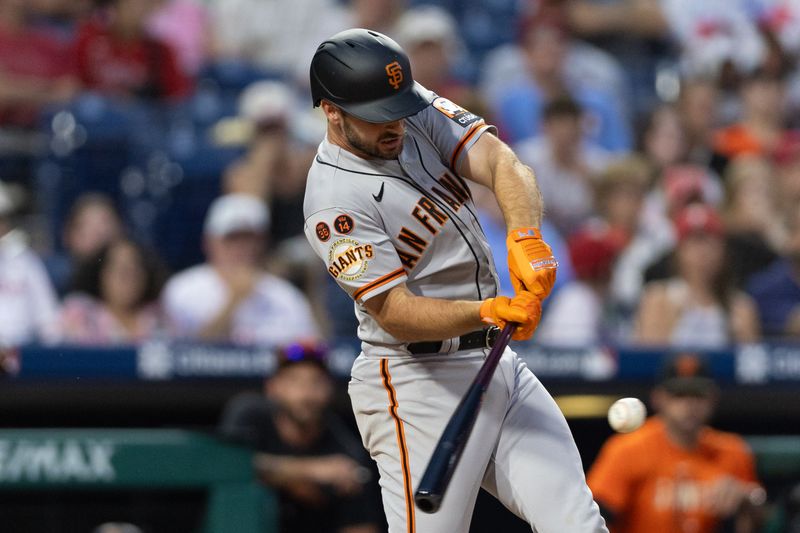 Aug 23, 2023; Philadelphia, Pennsylvania, USA; San Francisco Giants infielder Paul DeJong hits a two RBI single during the tenth inning against the Philadelphia Phillies at Citizens Bank Park. Mandatory Credit: Bill Streicher-USA TODAY Sports