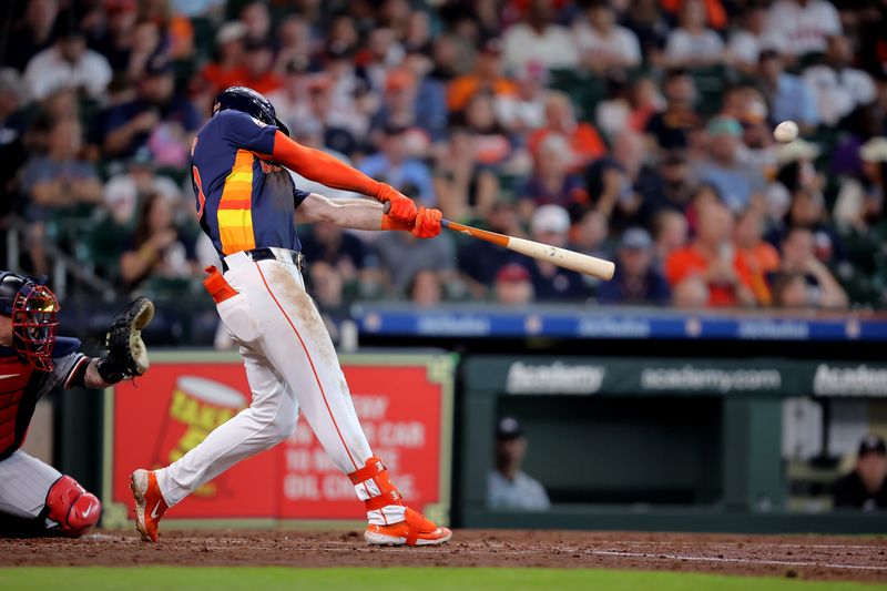 Jun 1, 2024; Houston, Texas, USA; Houston Astros right fielder Kyle Tucker (30) hits a home run against the Minnesota Twins during the third inning at Minute Maid Park. Mandatory Credit: Erik Williams-USA TODAY Sports