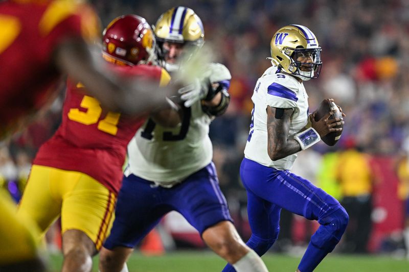 Nov 4, 2023; Los Angeles, California, USA; Washington Huskies quarterback Michael Penix Jr. (9) looks to pass against the USC Trojans during the fourth quarter at United Airlines Field at Los Angeles Memorial Coliseum. Mandatory Credit: Jonathan Hui-USA TODAY Sports