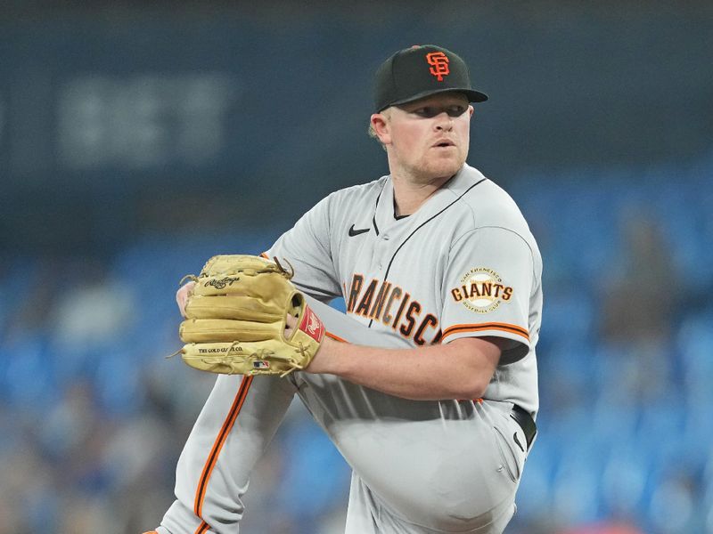 Jun 28, 2023; Toronto, Ontario, CAN; San Francisco Giants starting pitcher Logan Webb (62) throws a pitch against the Toronto Blue Jays during the first inning at Rogers Centre. Mandatory Credit: Nick Turchiaro-USA TODAY Sports