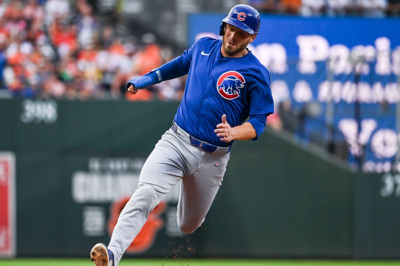 Jul 11, 2024; Baltimore, Maryland, USA; Chicago Cubs first baseman Michael Busch (29) rrounds third base on outfielder Seiya Suzuki (not pictured) third inning double against the Baltimore Orioles at Oriole Park at Camden Yards. Mandatory Credit: Tommy Gilligan-USA TODAY Sports