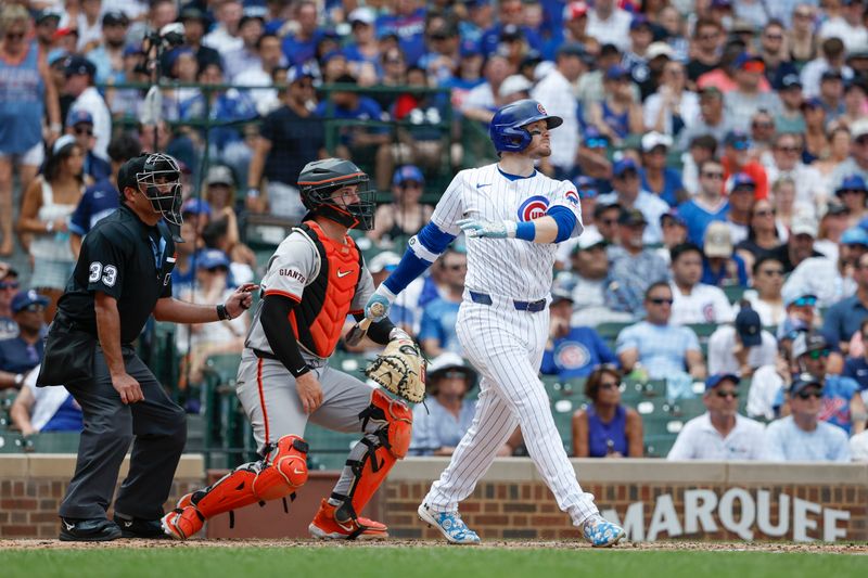 Jun 19, 2024; Chicago, Illinois, USA; Chicago Cubs outfielder Ian Happ (8) hits a solo home run against the San Francisco Giants during the fourth inning at Wrigley Field. Mandatory Credit: Kamil Krzaczynski-USA TODAY Sports