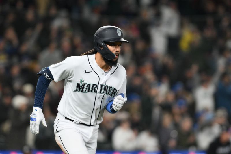 Apr 15, 2023; Seattle, Washington, USA; Seattle Mariners shortstop J.P. Crawford (3) runs towards first base after hitting an RBI single against the Colorado Rockies during the fourth inning at T-Mobile Park. Mandatory Credit: Steven Bisig-USA TODAY Sports