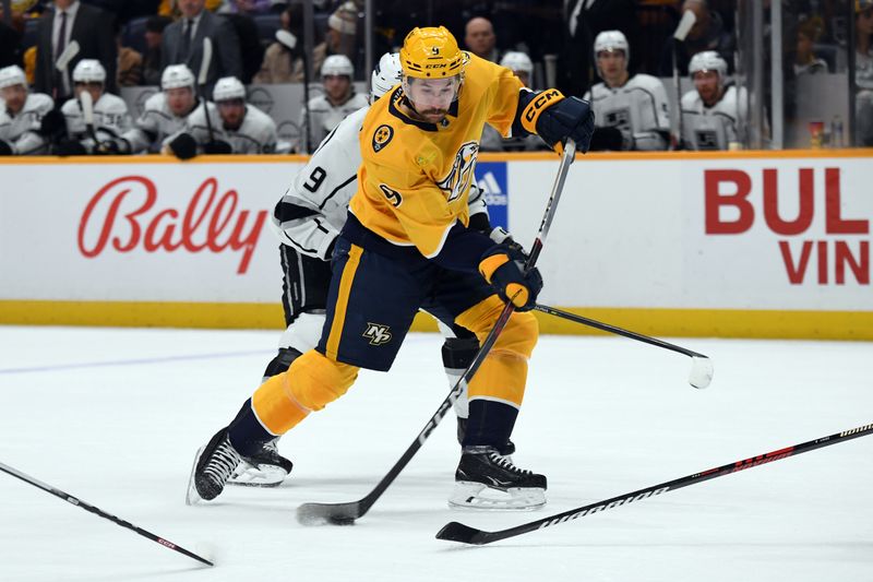 Jan 31, 2024; Nashville, Tennessee, USA; Nashville Predators left wing Filip Forsberg (9) shoots the puck on a play during the first period against the Los Angeles Kings at Bridgestone Arena. Mandatory Credit: Christopher Hanewinckel-USA TODAY Sports