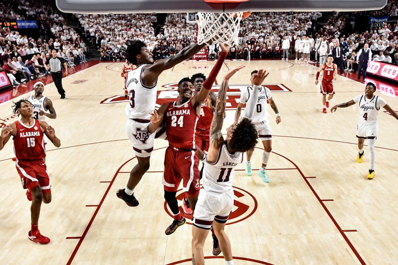 Mar 4, 2023; College Station, Texas, USA; Texas A&M Aggies forward Solomon Washington (13) blocks Alabama Crimson Tide forward Brandon Miller (24) shoot during the second half at Reed Arena. Mandatory Credit: Maria Lysaker-USA TODAY Sports