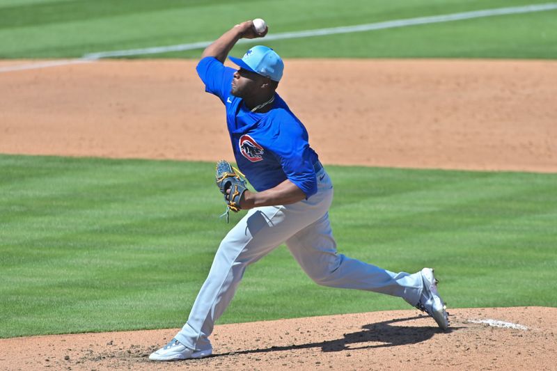 Mar 20, 2024; Mesa, Arizona, USA;  Chicago Cubs relief pitcher Hector Neris (51) throws in the third inning against the Oakland Athletics during a spring training game at Hohokam Stadium. Mandatory Credit: Matt Kartozian-USA TODAY Sports