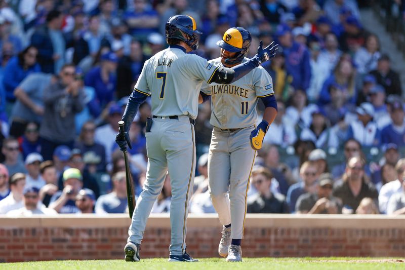 May 3, 2024; Chicago, Illinois, USA; Milwaukee Brewers outfielder Jackson Chourio (11) celebrates with third baseman Tyler Black (7) after scoring against the Chicago Cubs during the eight inning at Wrigley Field. Mandatory Credit: Kamil Krzaczynski-USA TODAY Sports