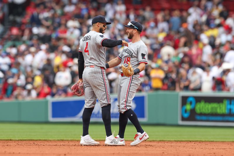 May 4, 2025; Boston, Massachusetts, USA; Minnesota Twins shortstop Carlos Correa (4) and Minnesota Twins second baseman Kody Clemens (18) celebrate after defeating the Boston Red Sox at Fenway Park. Mandatory Credit: Paul Rutherford-Imagn Images