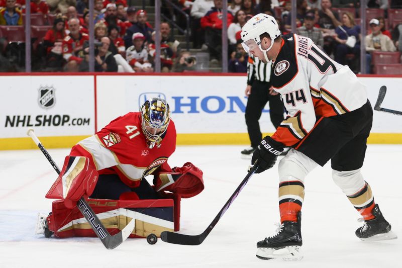 Jan 15, 2024; Sunrise, Florida, USA; Florida Panthers goaltender Anthony Stolarz (41) makes a save against Anaheim Ducks left wing Ross Johnston (44) during the first period at Amerant Bank Arena. Mandatory Credit: Sam Navarro-USA TODAY Sports