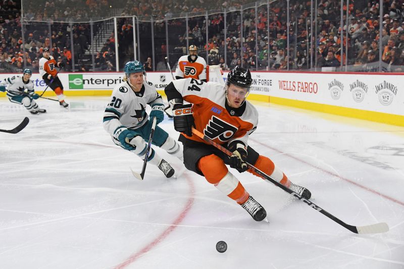 Nov 11, 2024; Philadelphia, Pennsylvania, USA; Philadelphia Flyers defenseman Nick Seeler (24) and San Jose Sharks left wing Fabian Zetterlund (20) chase after the puck during the second period at Wells Fargo Center. Mandatory Credit: Eric Hartline-Imagn Images