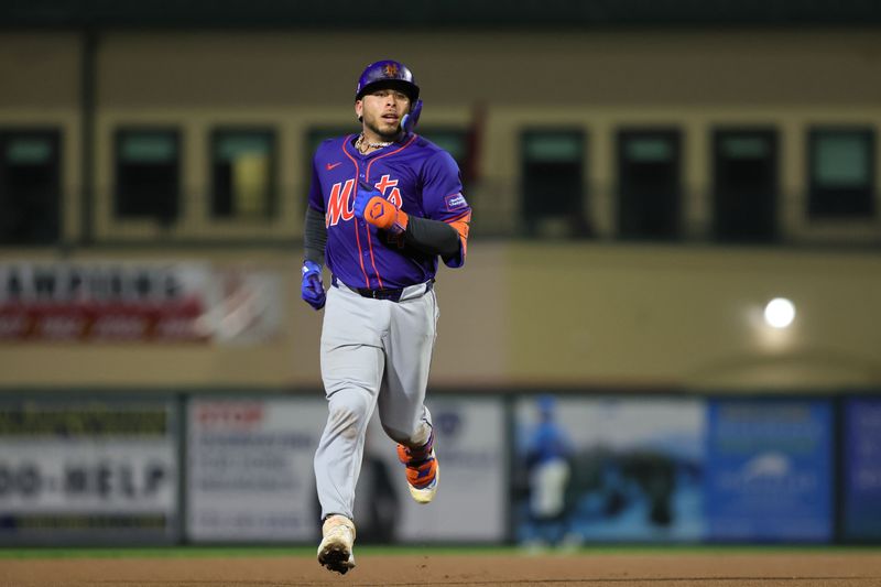 Mar 8, 2024; Jupiter, Florida, USA; New York Mets catcher Francisco Alvarez (4) circles the bases after hitting a home run against the Miami Marlins during the fourth inning at Roger Dean Chevrolet Stadium. Mandatory Credit: Sam Navarro-USA TODAY Sports