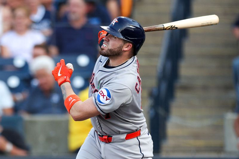 May 19, 2025; Tampa, Florida, USA; Houston Astros catcher Victor Caratini (17) hits a home run against the Tampa Bay Rays in the second inning at George M. Steinbrenner Field. Mandatory Credit: Nathan Ray Seebeck-Imagn Images
