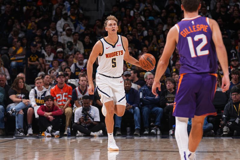 DENVER, CO - OCTOBER 13: Hunter Tyson #5 of the Denver Nuggets dribbles the ball during the game against the Phoenix Suns on October 13, 2024 at Ball Arena in Denver, Colorado. NOTE TO USER: User expressly acknowledges and agrees that, by downloading and/or using this Photograph, user is consenting to the terms and conditions of the Getty Images License Agreement. Mandatory Copyright Notice: Copyright 2024 NBAE (Photo by Bart Young/NBAE via Getty Images)