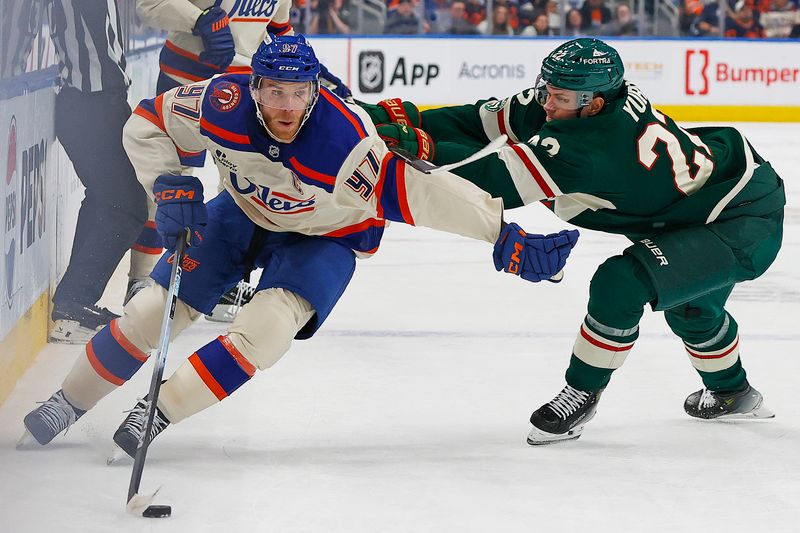 Jan 31, 2026; Edmonton, Alberta, CAN; Edmonton Oilers forward Connor McDavid (97) carries the puck around Minnesota Wild forward Dnila Yurov (22) during the first period at Rogers Place. Mandatory Credit: Perry Nelson-Imagn Images