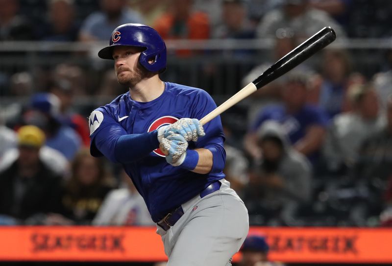 Apr 29, 2025; Pittsburgh, Pennsylvania, USA;  Chicago Cubs left fielder Ian Happ (8) hits a double against the Pittsburgh Pirates during the seventh inning at PNC Park. Mandatory Credit: Charles LeClaire-Imagn Images
