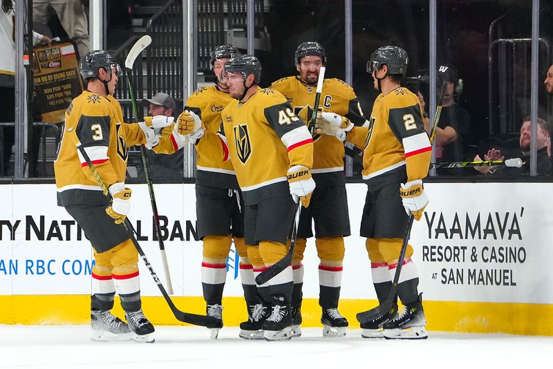 Oct 11, 2024; Las Vegas, Nevada, USA; Vegas Golden Knights center Ivan Barbashev (49) celebrates with team mates after scoring a goal against the St. Louis Blues during the first period at T-Mobile Arena. Mandatory Credit: Stephen R. Sylvanie-Imagn Images