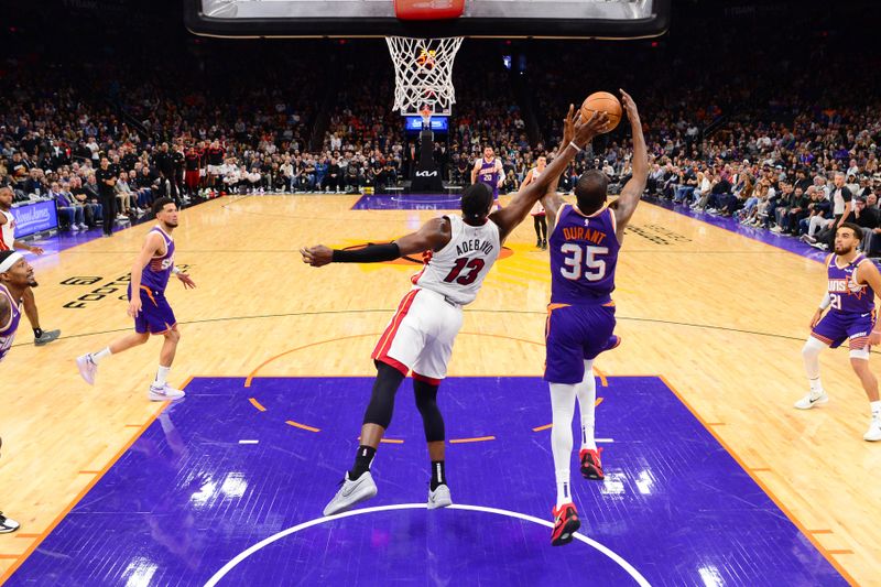 PHOENIX, AZ - NOVEMBER 6: Bam Adebayo #13 of the Miami Heat blocks the ball during the game against the Phoenix Suns on November 6, 2024 at Footprint Center in Phoenix, Arizona. NOTE TO USER: User expressly acknowledges and agrees that, by downloading and or using this photograph, user is consenting to the terms and conditions of the Getty Images License Agreement. Mandatory Copyright Notice: Copyright 2024 NBAE (Photo by Kate Frese/NBAE via Getty Images)