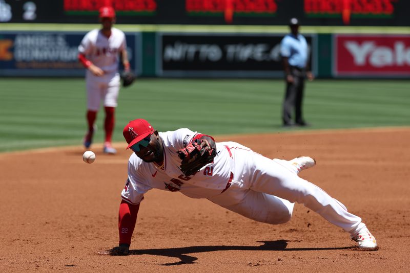 Jun 26, 2024; Anaheim, California, USA;  Los Angeles Angels third baseman Miguel Sano (22) fields a base hit by Oakland Athletics second baseman Armando Alvarez (not pictured) during the second inning at Angel Stadium. Mandatory Credit: Kiyoshi Mio-USA TODAY Sports