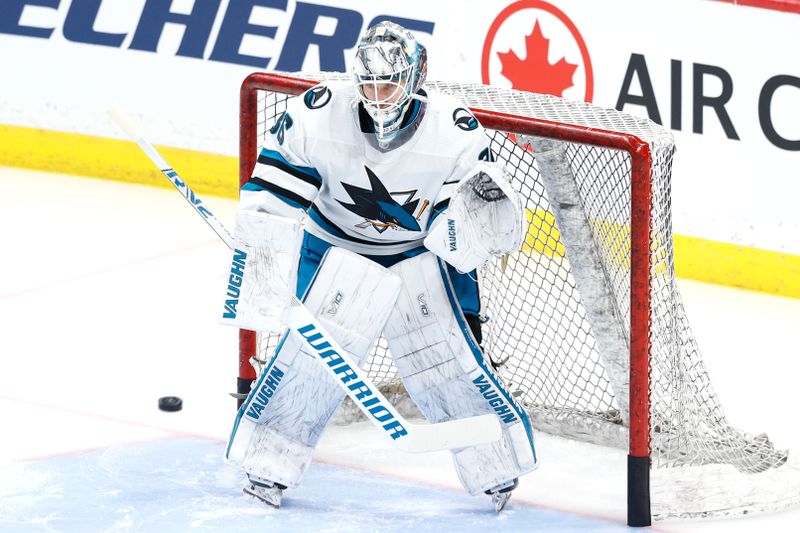 Feb 14, 2024; Winnipeg, Manitoba, CAN; San Jose Sharks goaltender Kaapo Kahkonen (36) warms up before a game against the Winnipeg Jets at Canada Life Centre. Mandatory Credit: James Carey Lauder-USA TODAY Sports