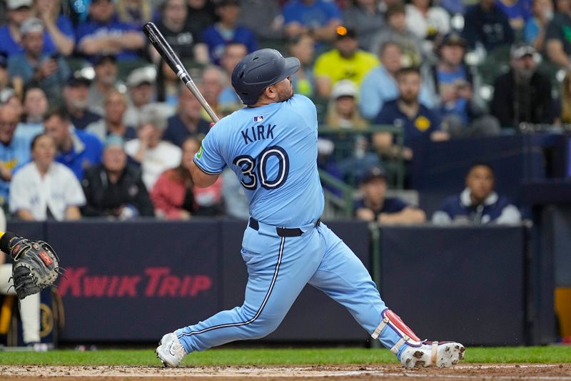 Jun 10, 2024; Milwaukee, Wisconsin, USA;  Toronto Blue Jays catcher Alejandro Kirk (30) hits a home run during the third inning against the Milwaukee Brewers at American Family Field. Mandatory Credit: Jeff Hanisch-USA TODAY Sports