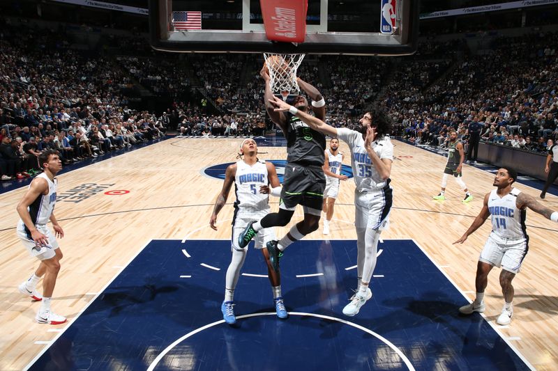 MINNEAPOLIS, MN -  MARCH 14:  Anthony Edwards #5 of the Minnesota Timberwolves drives to the basket during the game against the Orlando Magic  on March 14, 2025 at Target Center in Minneapolis, Minnesota. NOTE TO USER: User expressly acknowledges and agrees that, by downloading and or using this Photograph, user is consenting to the terms and conditions of the Getty Images License Agreement. Mandatory Copyright Notice: Copyright 2025 NBAE (Photo by David Sherman/NBAE via Getty Images)