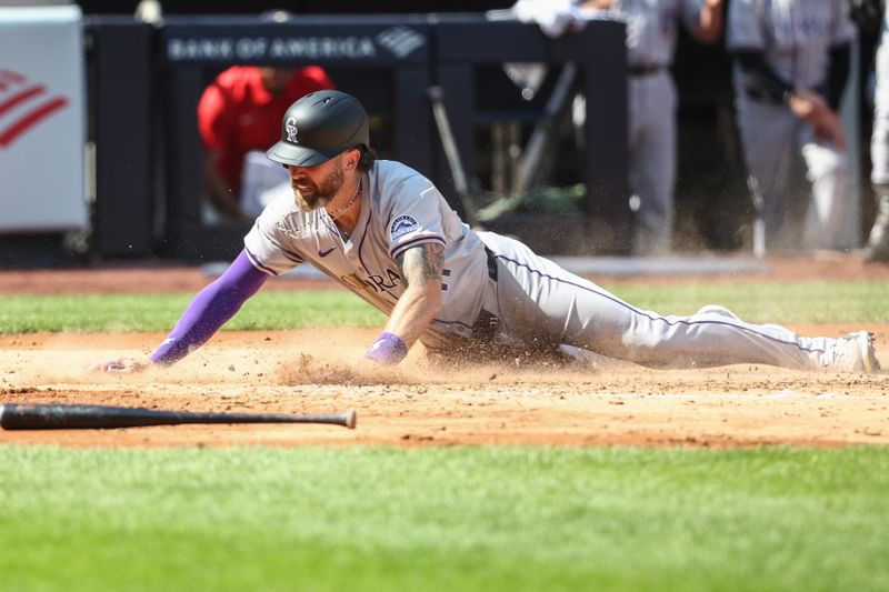 Aug 24, 2024; Bronx, New York, USA;  Colorado Rockies right fielder Jake Cave (11) scores a run in the third inning against the Colorado Rockies at Yankee Stadium. Mandatory Credit: Wendell Cruz-USA TODAY Sports
