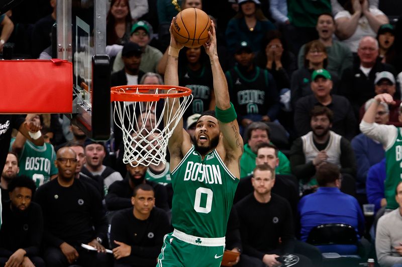 BOSTON, MA - APRIL 24: Jayson Tatum #0 of the Boston Celtics goes up for a dunk against the Miami Heat during the first quarter of game two of the Eastern Conference First Round Playoffs at TD Garden on April 24, 2024 in Boston, Massachusetts. NOTE TO USER: User expressly acknowledges and agrees that, by downloading and/or using this Photograph, user is consenting to the terms and conditions of the Getty Images License Agreement. (Photo By Winslow Townson/Getty Images)