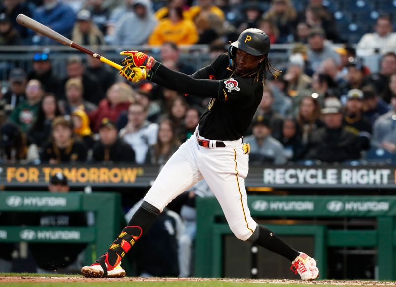 Apr 8, 2023; Pittsburgh, Pennsylvania, USA;  Pittsburgh Pirates shortstop Oneil Cruz (15) hits a single against the Chicago White Sox during the third inning at PNC Park. Mandatory Credit: Charles LeClaire-USA TODAY Sports