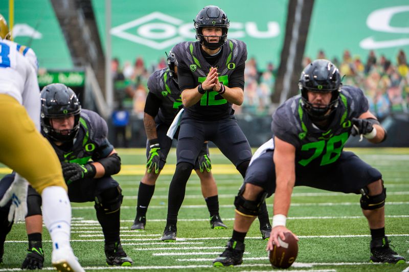 Nov 21, 2020; Eugene, Oregon, USA; Oregon Ducks quarterback Tyler Shough (12) calls out a play during the second half against the UCLA Bruins at Autzen Stadium. The Ducks won 38-35. Mandatory Credit: Troy Wayrynen-USA TODAY Sports