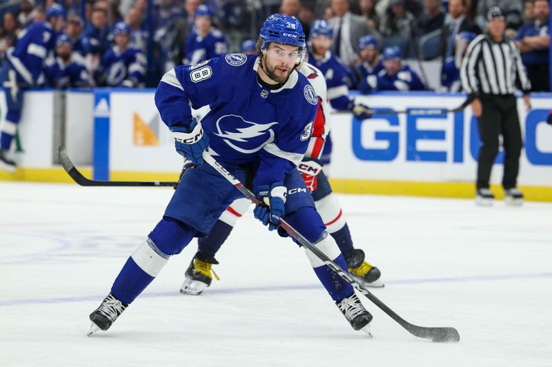 Feb 22, 2024; Tampa, Florida, USA;  Tampa Bay Lightning left wing Brandon Hagel (38) controls the puck against the Washington Capitals in the first period at Amalie Arena. Mandatory Credit: Nathan Ray Seebeck-USA TODAY Sports