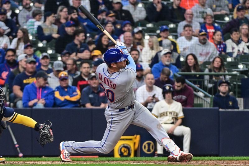 Apr 5, 2023; Milwaukee, Wisconsin, USA;  New York Mets first baseman Pete Alonso (20) watches after hitting a 2-run home run in the fifth inning against the Milwaukee Brewers at American Family Field. Mandatory Credit: Benny Sieu-USA TODAY Sports