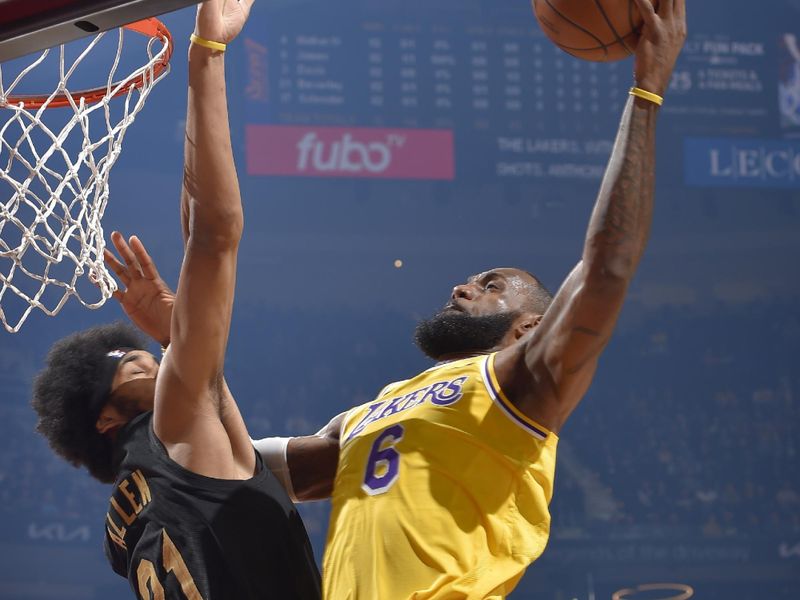 CLEVELAND, OH - DECEMBER 6: LeBron James #6 of the Los Angeles Lakers drives to the basket during the game against the Cleveland Cavaliers on December 6, 2022 at Rocket Mortgage FieldHouse in Cleveland, Ohio. NOTE TO USER: User expressly acknowledges and agrees that, by downloading and/or using this Photograph, user is consenting to the terms and conditions of the Getty Images License Agreement. Mandatory Copyright Notice: Copyright 2022 NBAE (Photo by David Liam Kyle/NBAE via Getty Images)