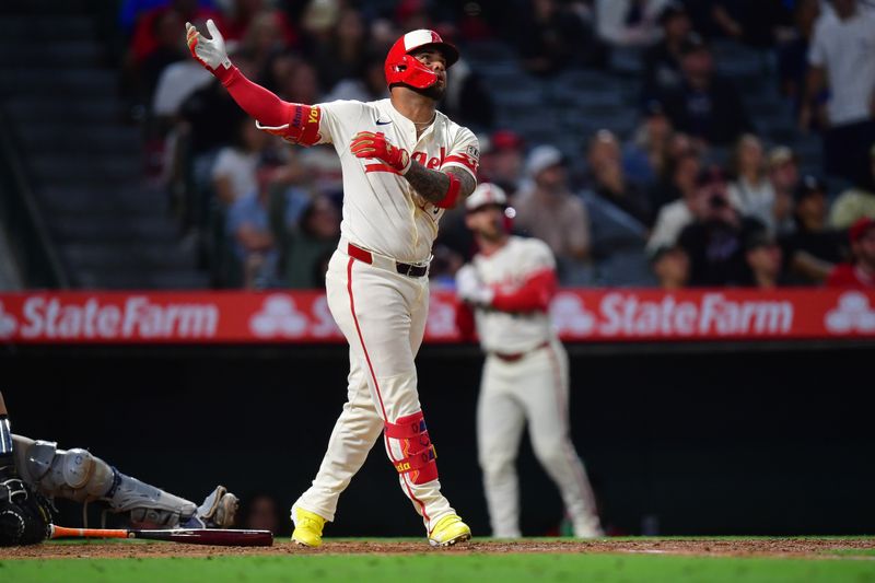 May 27, 2025; Anaheim, California, USA; Los Angeles Angels third baseman Yoan Moncada (5) hits a solo home run against the New York Yankees during the ninth inning at Angel Stadium. Mandatory Credit: Gary A. Vasquez-Imagn Images