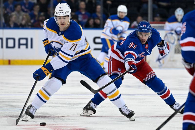 Nov 7, 2024; New York, New York, USA; Buffalo Sabres center Ryan McLeod (71) skirts with the puck chased by New York Rangers right wing Reilly Smith (91) during the first period at Madison Square Garden. Mandatory Credit: Dennis Schneidler-Imagn Images