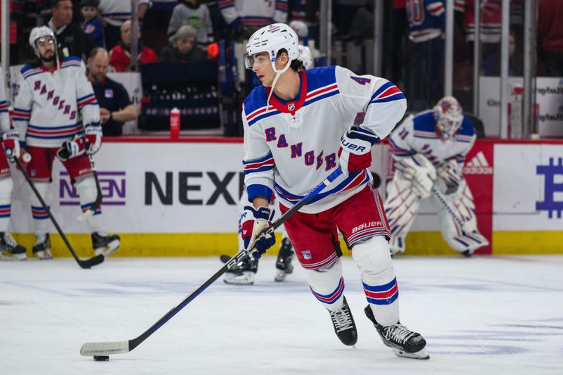 Feb 9, 2024; Chicago, Illinois, USA; New York Rangers defenseman Braden Schneider (4) warms up against the Chicago Blackhawks before the game at the United Center. Mandatory Credit: Daniel Bartel-USA TODAY Sports