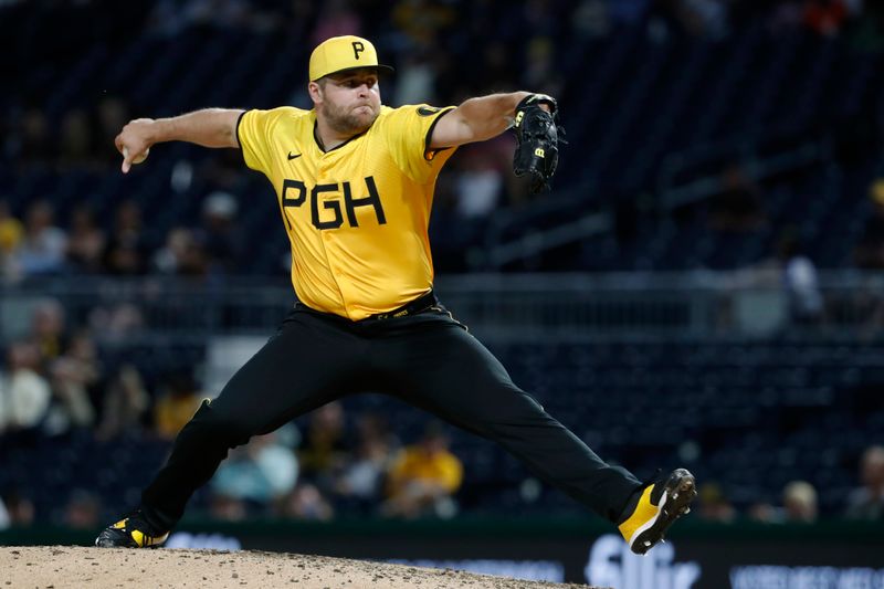 Jun 7, 2024; Pittsburgh, Pennsylvania, USA;  Pittsburgh Pirates pitcher David Bednar (51) pitches against the Minnesota Twins during the ninth inning at PNC Park. The Pirates shutout the Twins 3-0. Mandatory Credit: Charles LeClaire-USA TODAY Sports