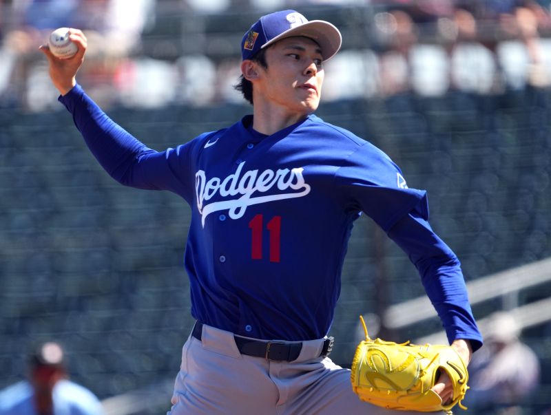 Mar 3, 2026; Goodyear, Arizona, USA; Los Angeles Dodgers starting pitcher Roki Sasaki (11) pitches against the Cleveland Guardians during the first inning at Goodyear Ballpark. Mandatory Credit: Joe Camporeale-Imagn Images