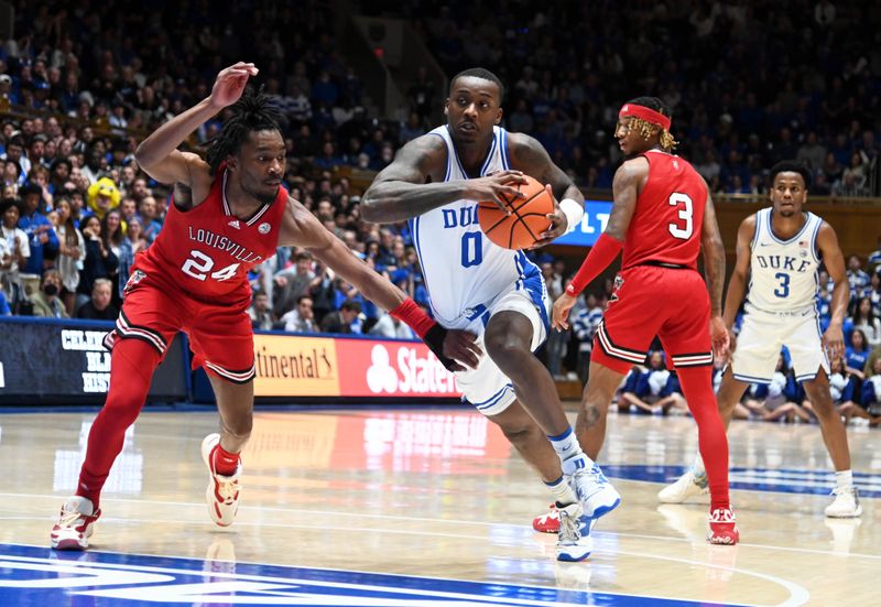 Feb 20, 2023; Durham, North Carolina, USA; Duke Blue Devils forward Dariq Whitehead (0) moves to the basket as Louisville Cardinals forward Jae'Lyn Withers (24) defends  during the second half at Cameron Indoor Stadium. The Blue Devils won 79-62. Mandatory Credit: Rob Kinnan-USA TODAY Sports