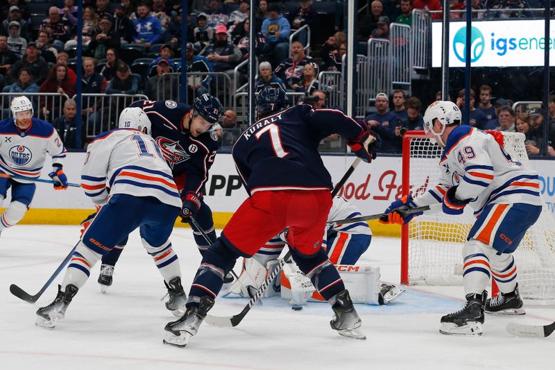 Oct 28, 2024; Columbus, Ohio, USA; Columbus Blue Jackets center Sean Kuraly (7) looks for a rebound of a Edmonton Oilers goalie Stuart Skinner (74) save during the second period at Nationwide Arena. Mandatory Credit: Russell LaBounty-Imagn Images