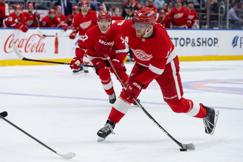 Oct 30, 2023; Elmont, New York, USA; Detroit Red Wings center Andrew Copp (18) takes a shot against the New York Islanders during the first period at UBS Arena. Mandatory Credit: Thomas Salus-USA TODAY Sports