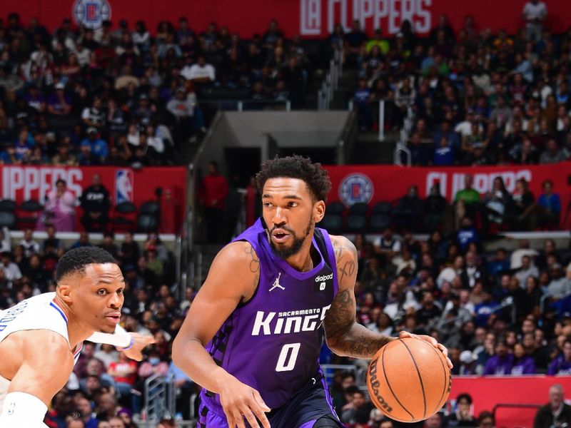 LOS ANGELES, CA - FEBRUARY 25: Malik Monk #0 of the Sacramento Kings dribbles the ball during the game against the LA Clippers on February 25, 2024 at Crypto.Com Arena in Los Angeles, California. NOTE TO USER: User expressly acknowledges and agrees that, by downloading and/or using this Photograph, user is consenting to the terms and conditions of the Getty Images License Agreement. Mandatory Copyright Notice: Copyright 2024 NBAE (Photo by Adam Pantozzi/NBAE via Getty Images)