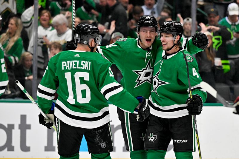 Nov 14, 2023; Dallas, Texas, USA; Dallas Stars center Joe Pavelski (16) and center Roope Hintz (24) and defenseman Miro Heiskanen (4) celebrates a power play goal scored by Hintz against the Arizona Coyotes during the second period at the American Airlines Center. Mandatory Credit: Jerome Miron-USA TODAY Sports