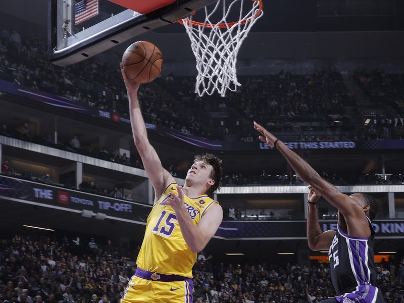 SACRAMENTO, CA - MARCH 13:  Austin Reaves #15 of the Los Angeles Lakers drives to the basket during the game against the Sacramento Kings on March 13, 2024 at Golden 1 Center in Sacramento, California. NOTE TO USER: User expressly acknowledges and agrees that, by downloading and or using this Photograph, user is consenting to the terms and conditions of the Getty Images License Agreement. Mandatory Copyright Notice: Copyright 2024 NBAE (Photo by Rocky Widner/NBAE via Getty Images)