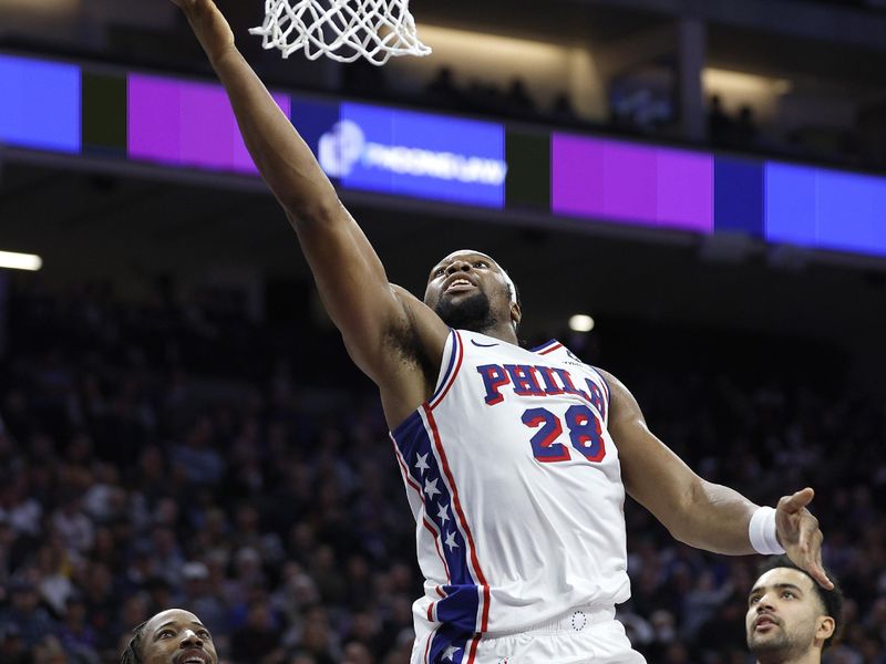 SACRAMENTO, CALIFORNIA - JANUARY 01: Guerschon Yabusele #28 of the Philadelphia 76ers shoots over DeMar DeRozan #10 of the Sacramento Kings during the second half of an NBA basketball game at Golden 1 Center on January 01, 2025 in Sacramento, California. NOTE TO USER: User expressly acknowledges and agrees that, by downloading and or using this photograph, User is consenting to the terms and conditions of the Getty Images License Agreement. (Photo by Thearon W. Henderson/Getty Images)