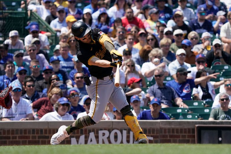 May 17, 2024; Chicago, Illinois, USA; Pittsburgh Pirates outfielder Connor Joe (2) hits a single against the Chicago Cubs during the first inning at Wrigley Field. Mandatory Credit: David Banks-USA TODAY Sports