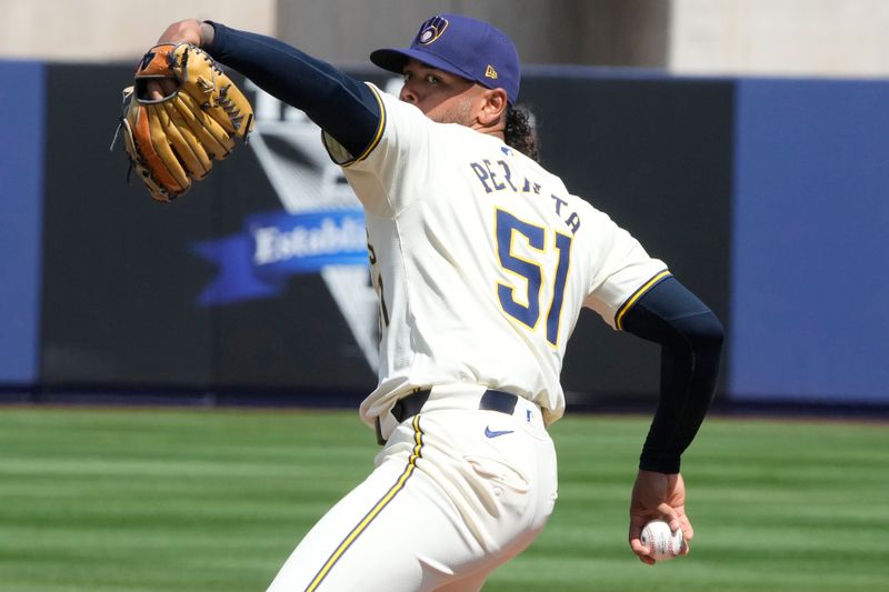 Mar 16, 2024; Phoenix, Arizona, USA; Milwaukee Brewers starting pitcher Freddy Peralta (51) throws against the Texas Rangers in the first inning at American Family Fields of Phoenix. Mandatory Credit: Rick Scuteri-USA TODAY Sports