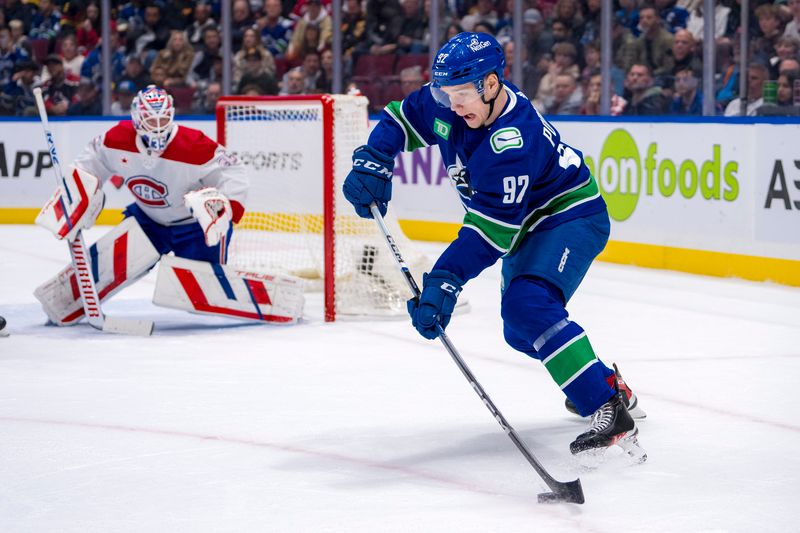 Mar 21, 2024; Vancouver, British Columbia, CAN; Vancouver Canucks forward Vasily Podkolzin (92) handles the puck against the Montreal Canadiens in the first period at Rogers Arena. Mandatory Credit: Bob Frid-USA TODAY Sports