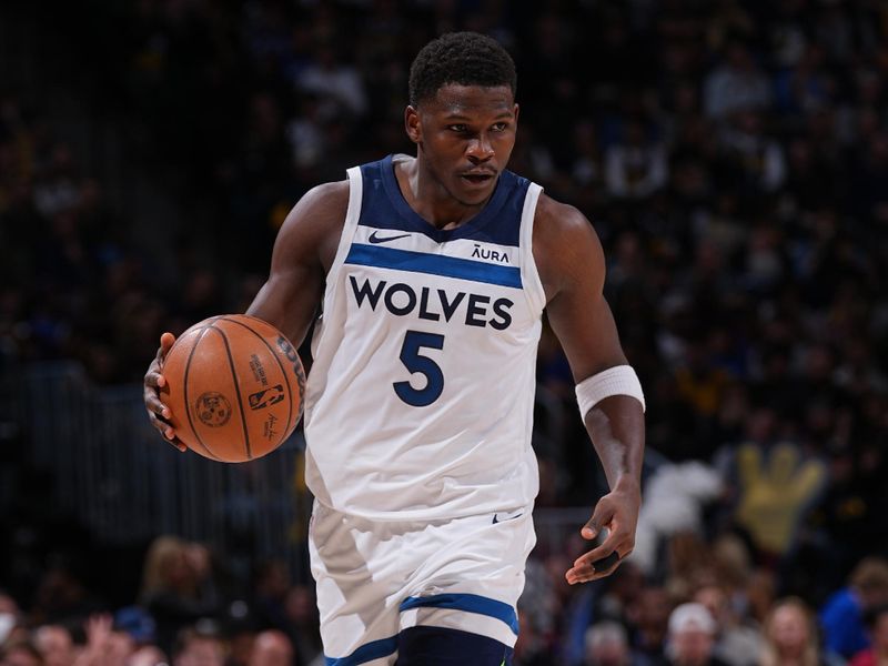 DENVER, CO - APRIL 10: Anthony Edwards #5 of the Minnesota Timberwolves dribbles the ball during the game against the Denver Nuggets on April 10, 2024 at the Ball Arena in Denver, Colorado. NOTE TO USER: User expressly acknowledges and agrees that, by downloading and/or using this Photograph, user is consenting to the terms and conditions of the Getty Images License Agreement. Mandatory Copyright Notice: Copyright 2024 NBAE (Photo by Bart Young/NBAE via Getty Images)