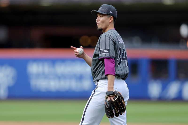 May 31, 2025; New York City, New York, USA; New York Mets starting pitcher Kodai Senga (34) reacts after a defensive play by third baseman Brett Baty (not pictured) during the third inning against the Colorado Rockies at Citi Field. Mandatory Credit: Brad Penner-Imagn Images